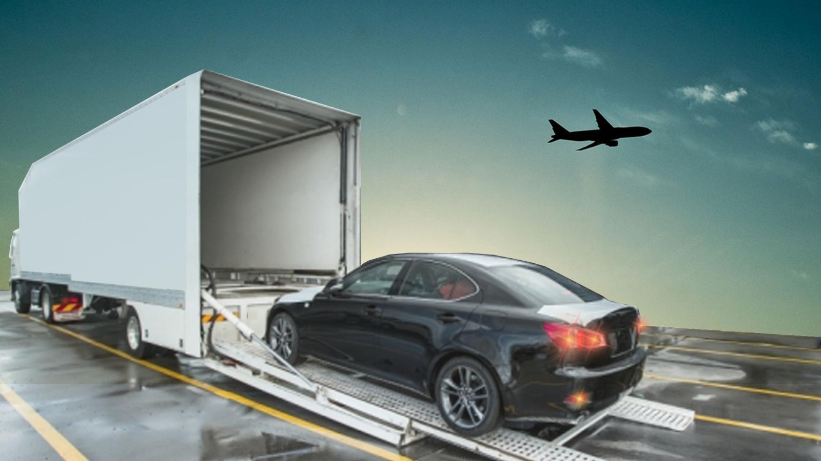 Car being loaded into a transport truck at airport; how to transport a vehicle to another statey.